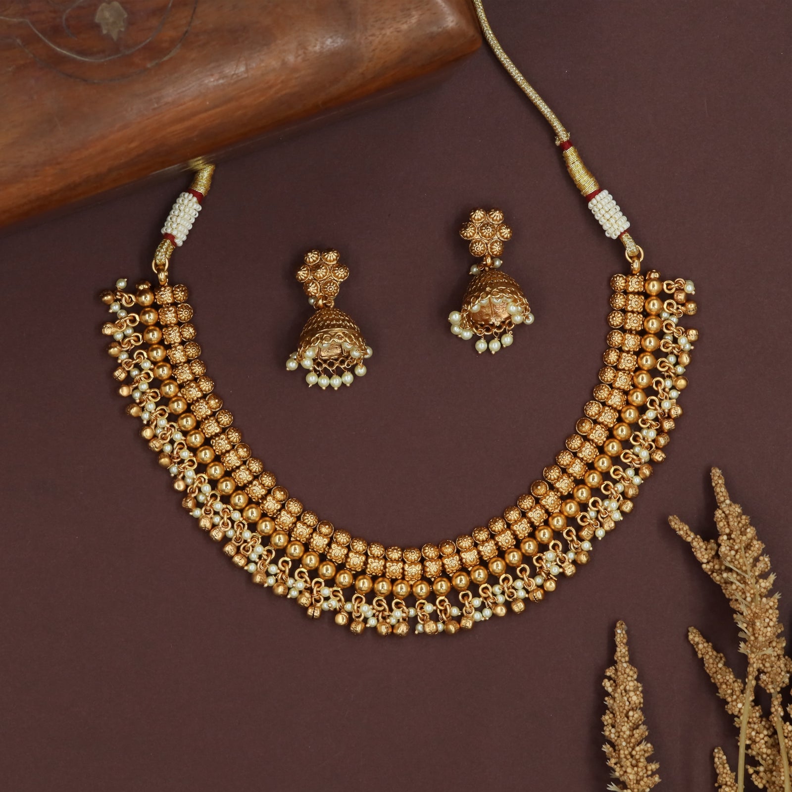 Parallel bead row antique necklace with structured layers and loop fringe detail