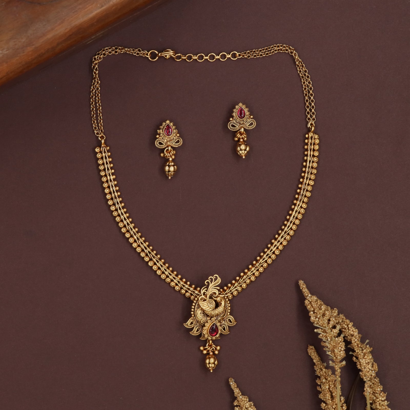 Minimal dual strand antique necklace with smooth bead rows and peacock pendant