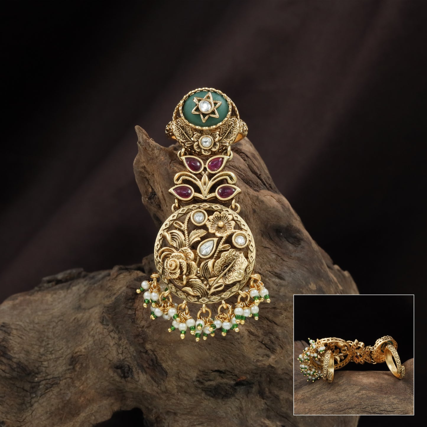 Star top kundan finger ring with layered connector leaves and carved circular drop plate