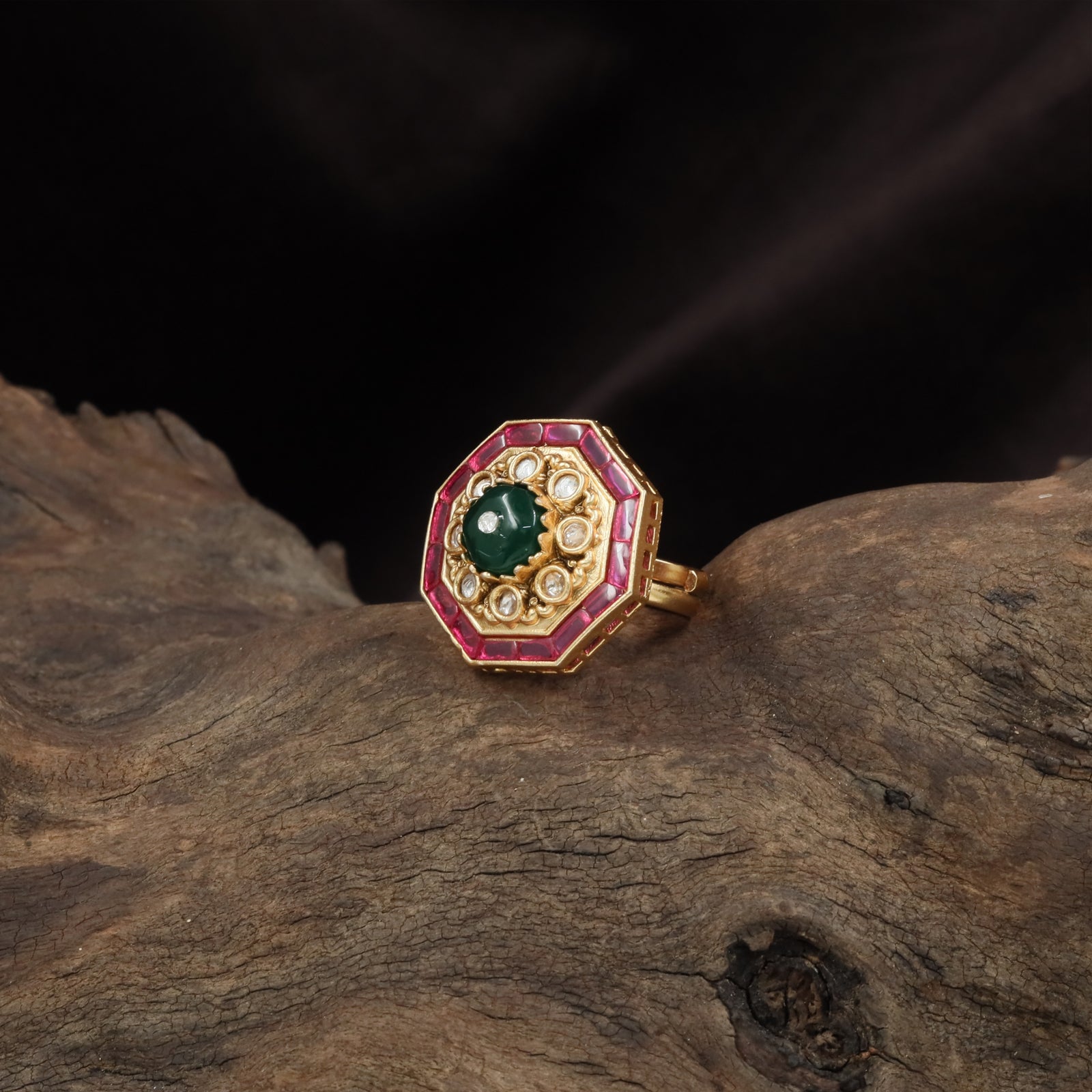 Octagonal frame kundan finger ring with central dome stone and bordered setting