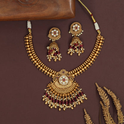 Dense bead kundan necklace with structured rows and scalloped pendant fringe