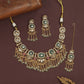 Decorative oval kundan necklace with linked panels and layered fringe drops