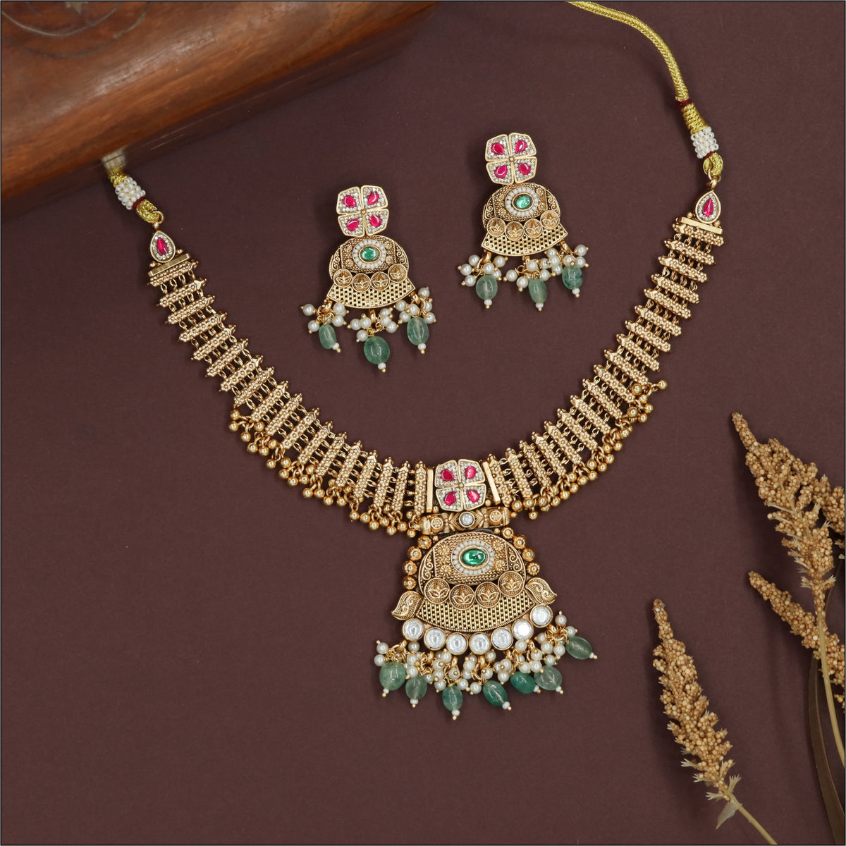 Cutwork segment kundan necklace with structured panels and dense fringe clusters