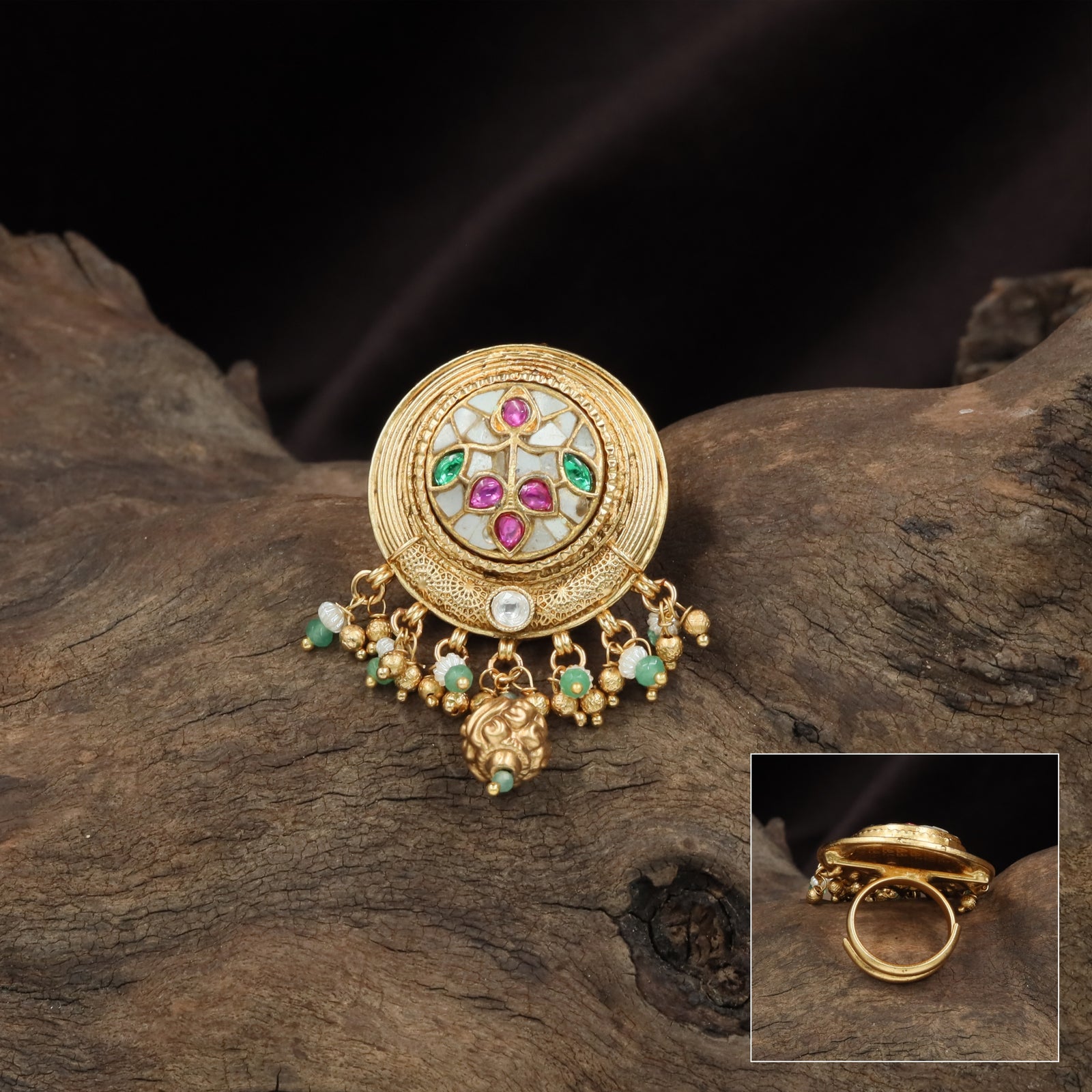 Circular disc kundan finger ring with carved radial layers and floral center cluster with drop fringe