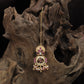 Circular top kundan tikka with leaf cluster connectors and framed drop medallion