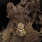 Dual section kundan tikka with circular top frame and engraved lower crescent