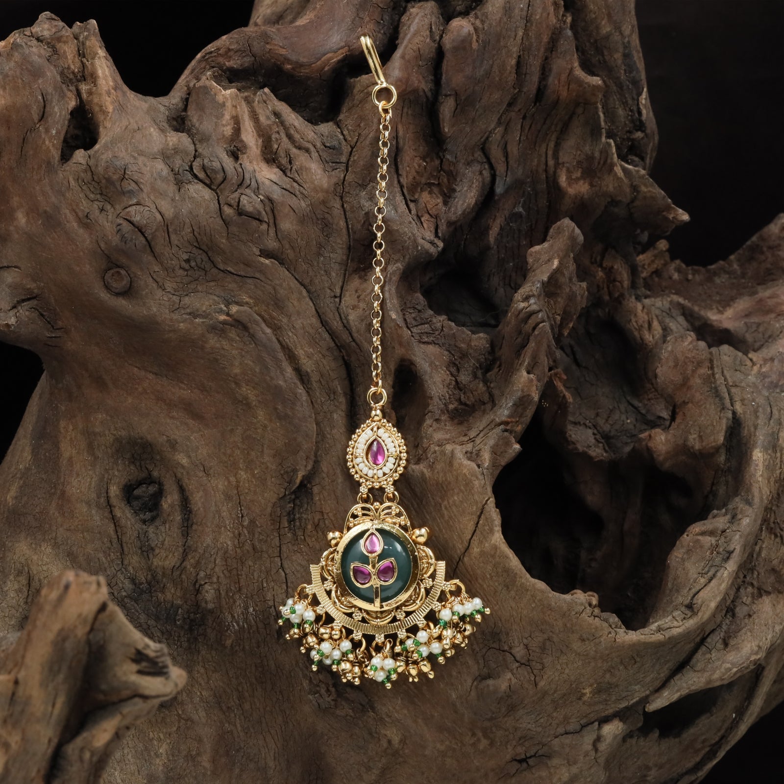 Decorative kundan tikka with vertical top unit and broad circular drop section