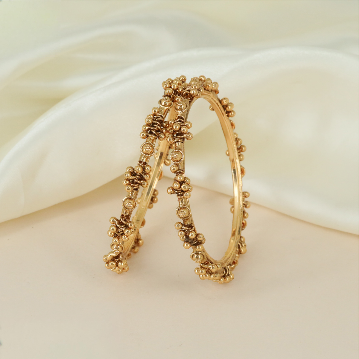 Crafted Antique Bangles Showcasing Fine Beadwork And Repeated Circular Embellishments