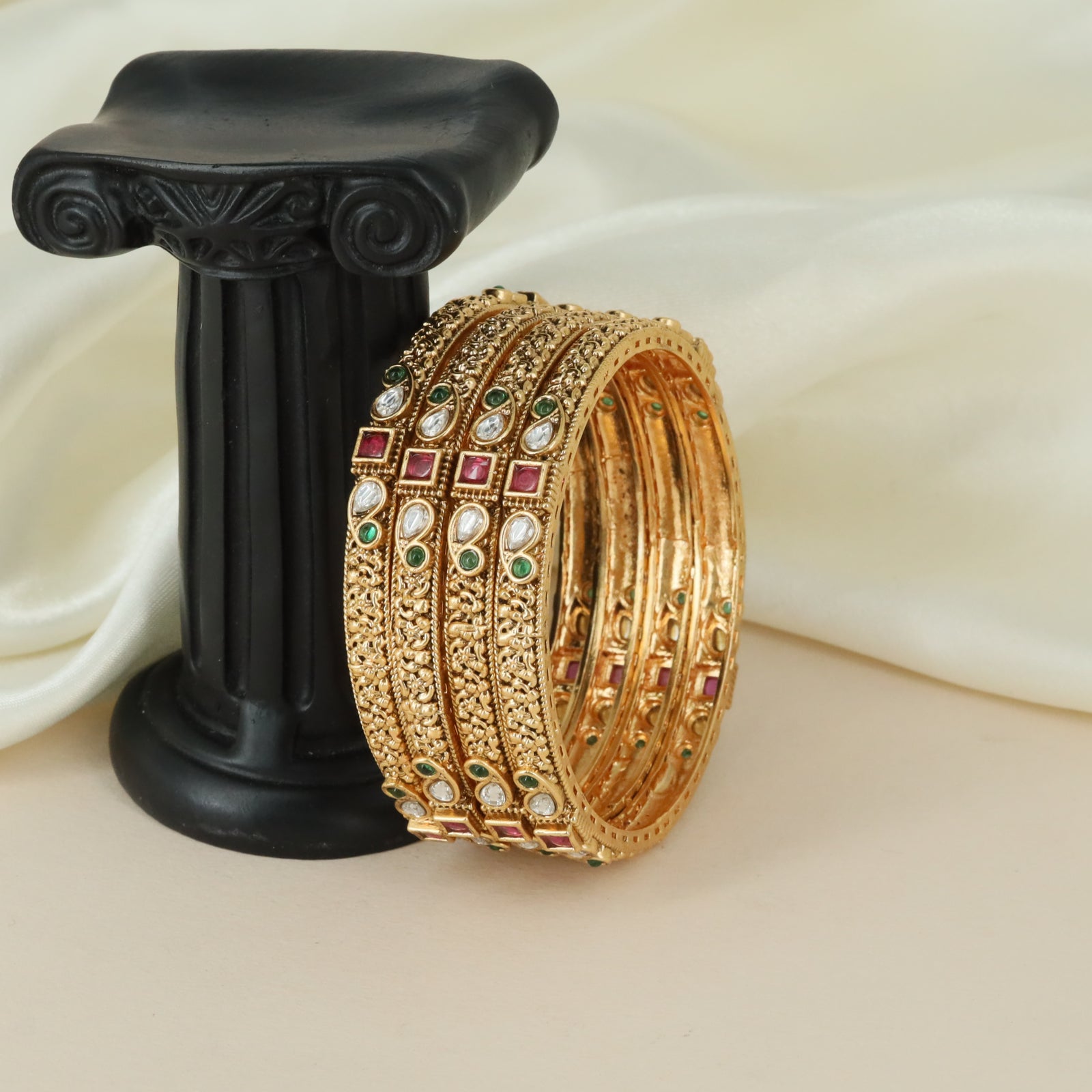 Symmetrical motif artistry Antique bangles with ornamental detailing