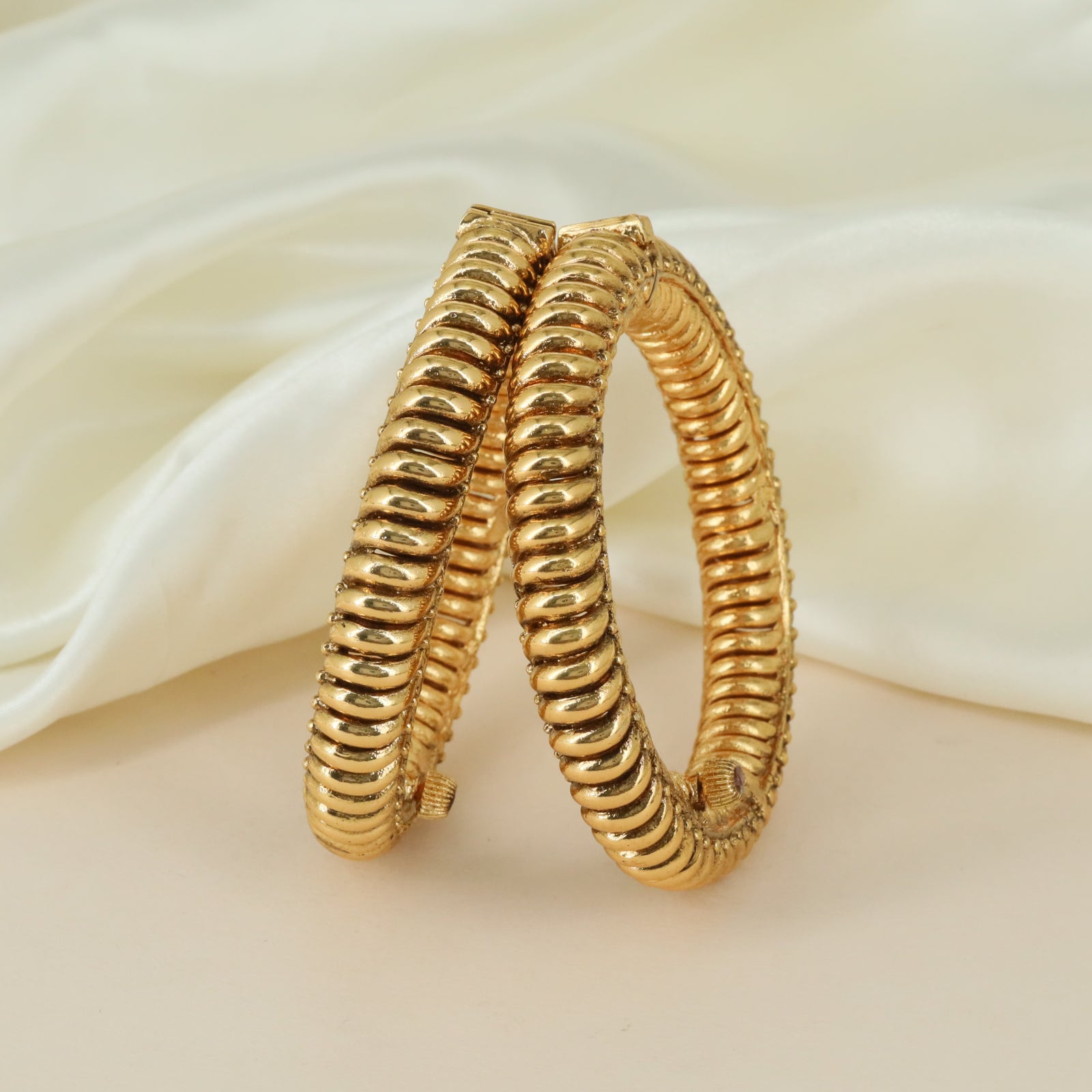 Ribbed coil artistry Antique bangles with ornamental detailing