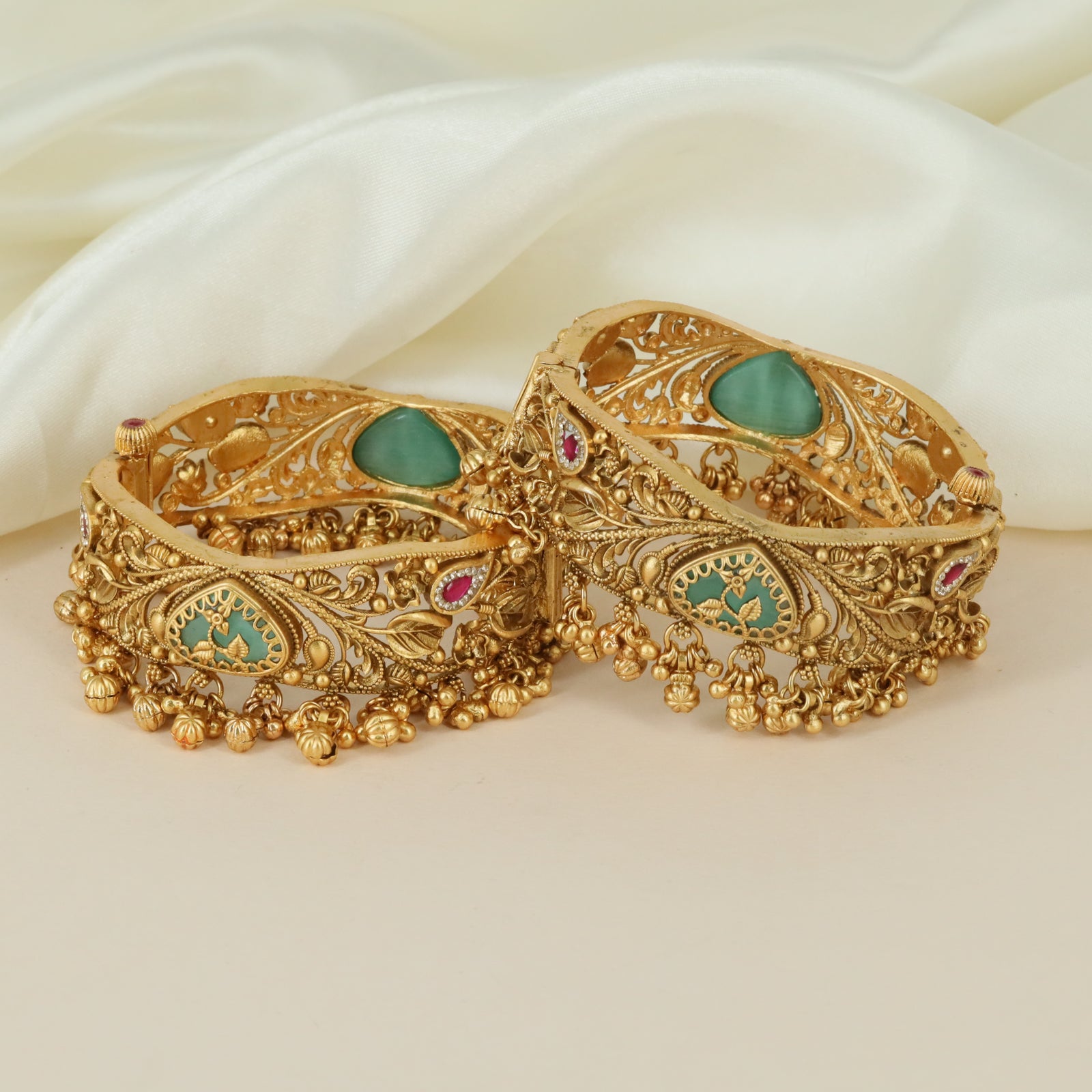 Designer ornamental motif Kundan bangles with intricate finish