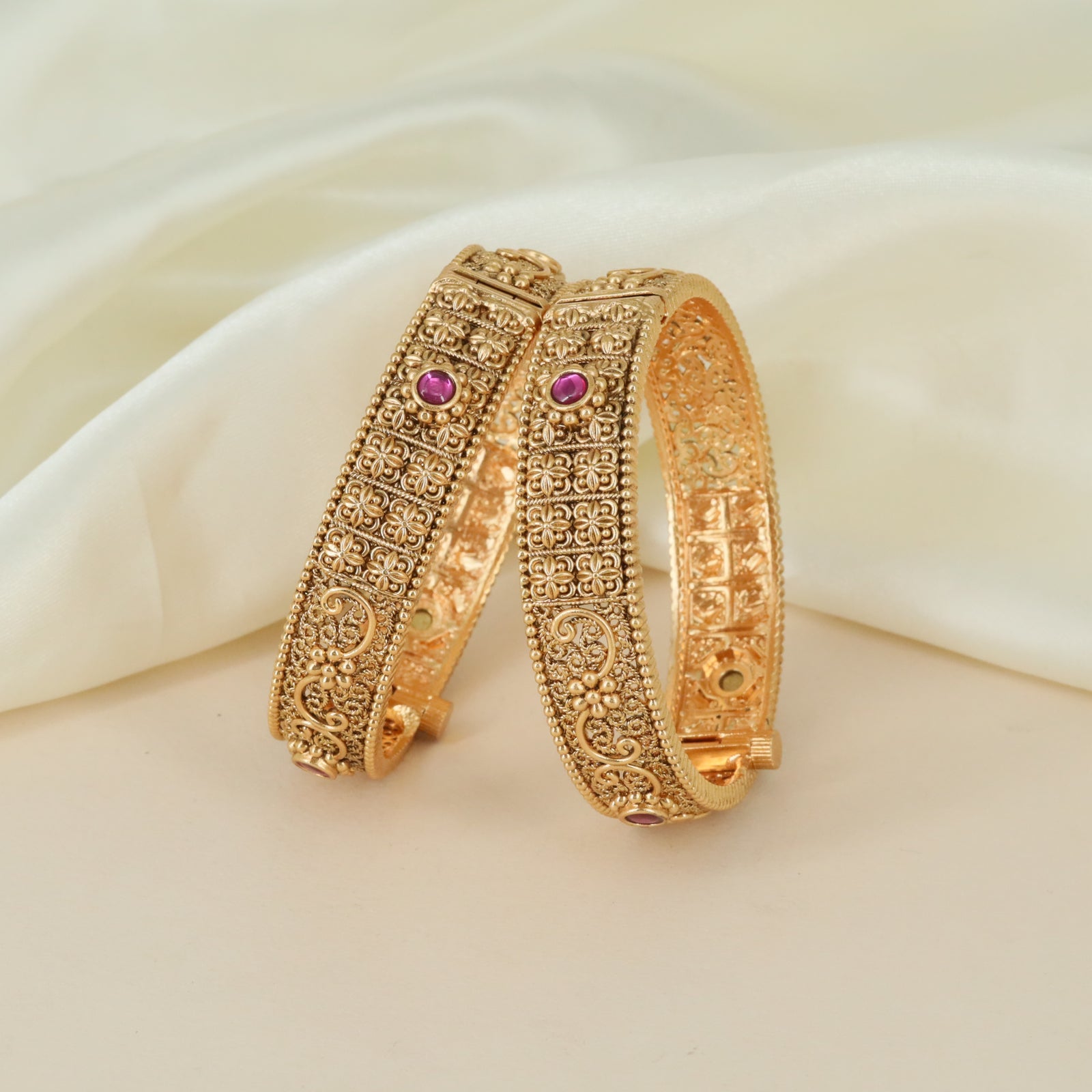 Floral motif artistry Antique bangles with ornamental detailing