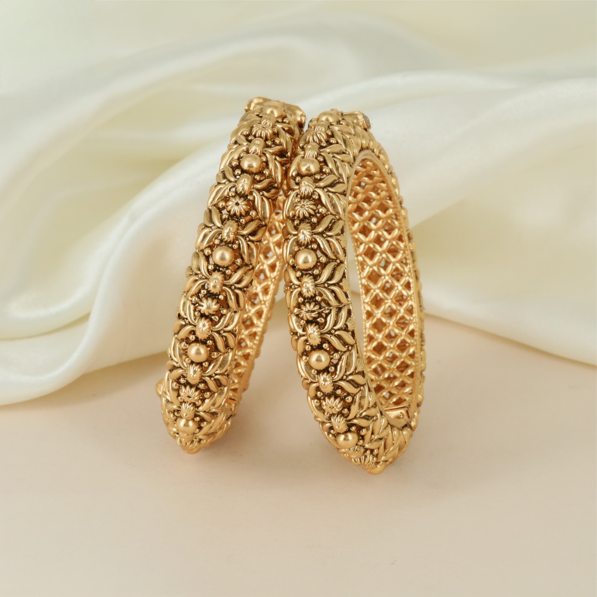 Graceful Traditional Bangles Featuring Sculpted Flowers And Ornamental Foliage