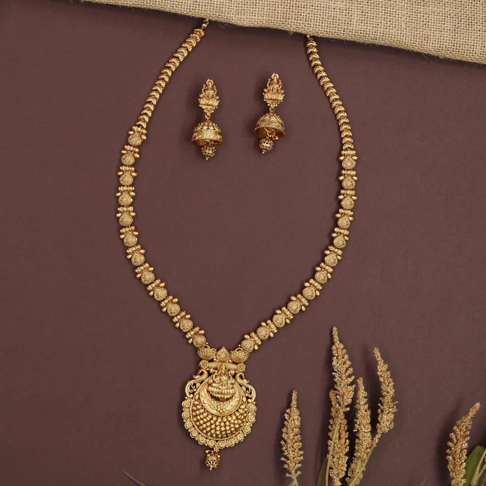 Empire Disc Pattern Long Haara with Lakshmi Engraved Pendant Center