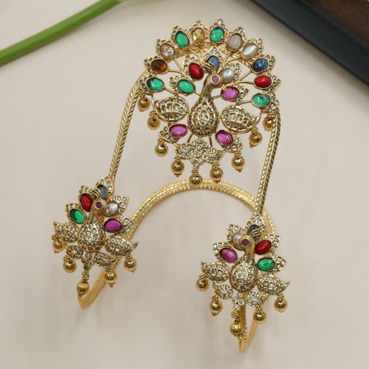 Sculpted Peacock Antique Vanki with Graceful Hanging Accents