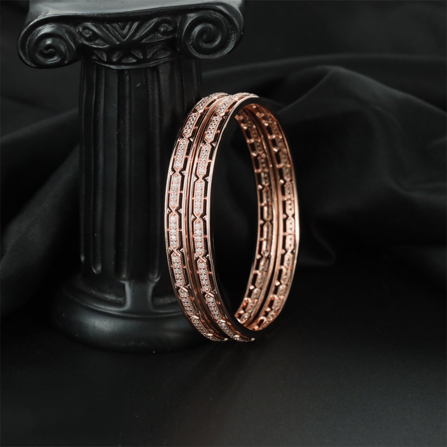 Distinctive Rose Gold Bangles Featuring Framed Linear Sections