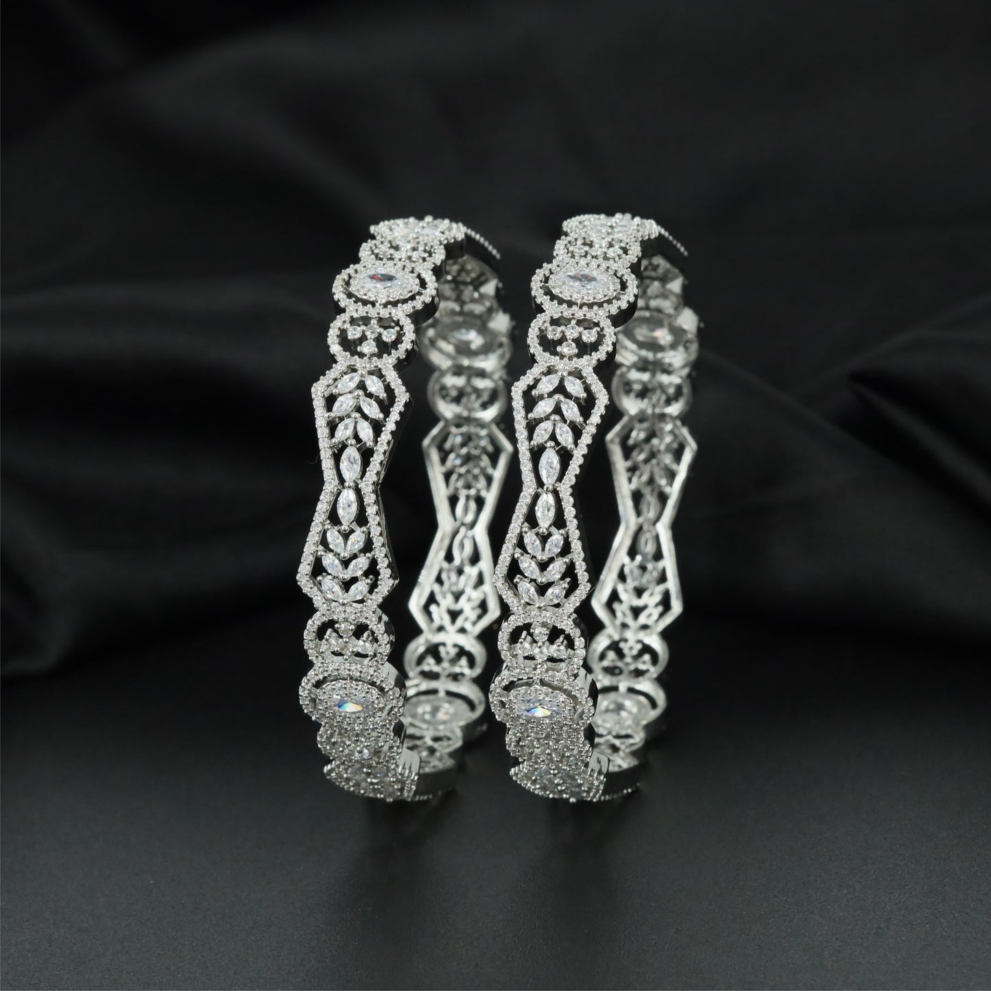Orbit Crest Rhodium Bangles with Oval Centre Alignment