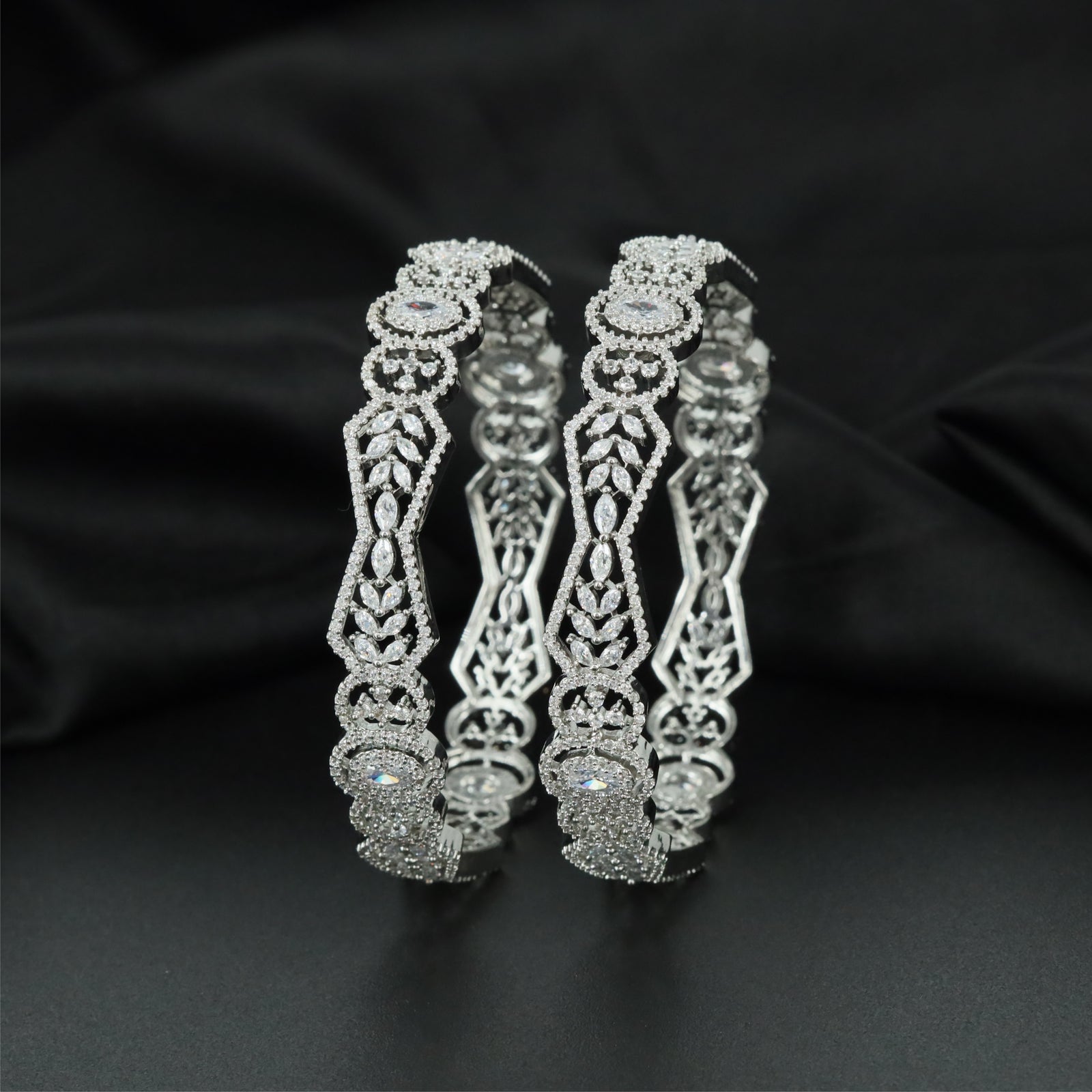 Orbit Crest Rhodium Bangles with Oval Centre Alignment
