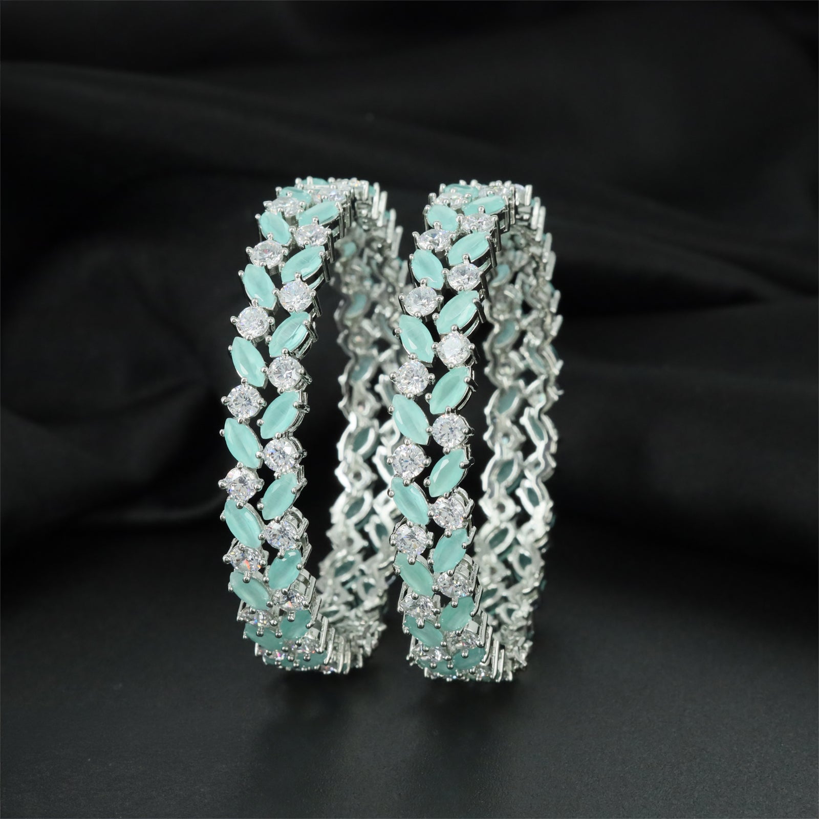 Leaf Rhodium Bangles with Alternating Oval and Round Settings