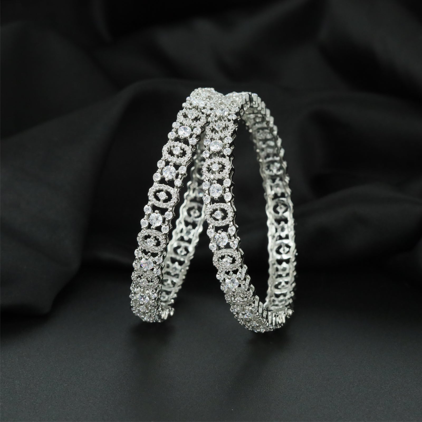 Infinity Circle Rhodium Bangles with Sculpted Open Gallery Detailing