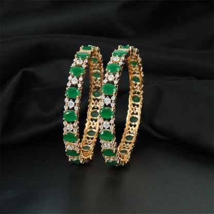Graceful GJ Bangles Featuring Oval Settings and Petal Clusters