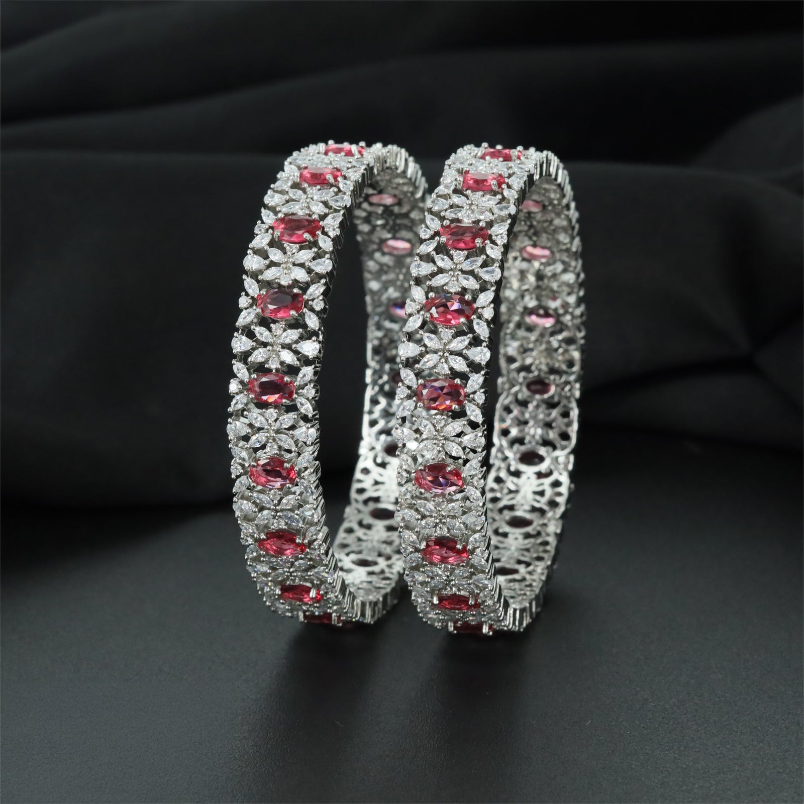 Refined Rhodium Bangles with Alternating Oval and Floral Forms