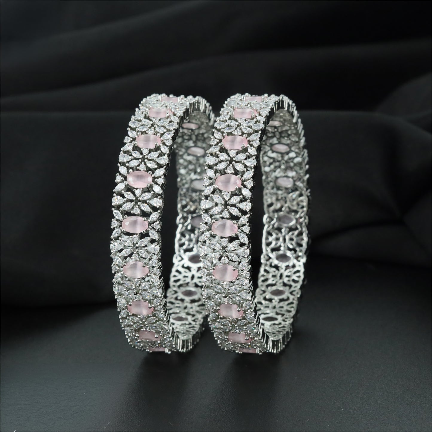 Refined Rhodium Bangles with Alternating Oval and Floral Forms
