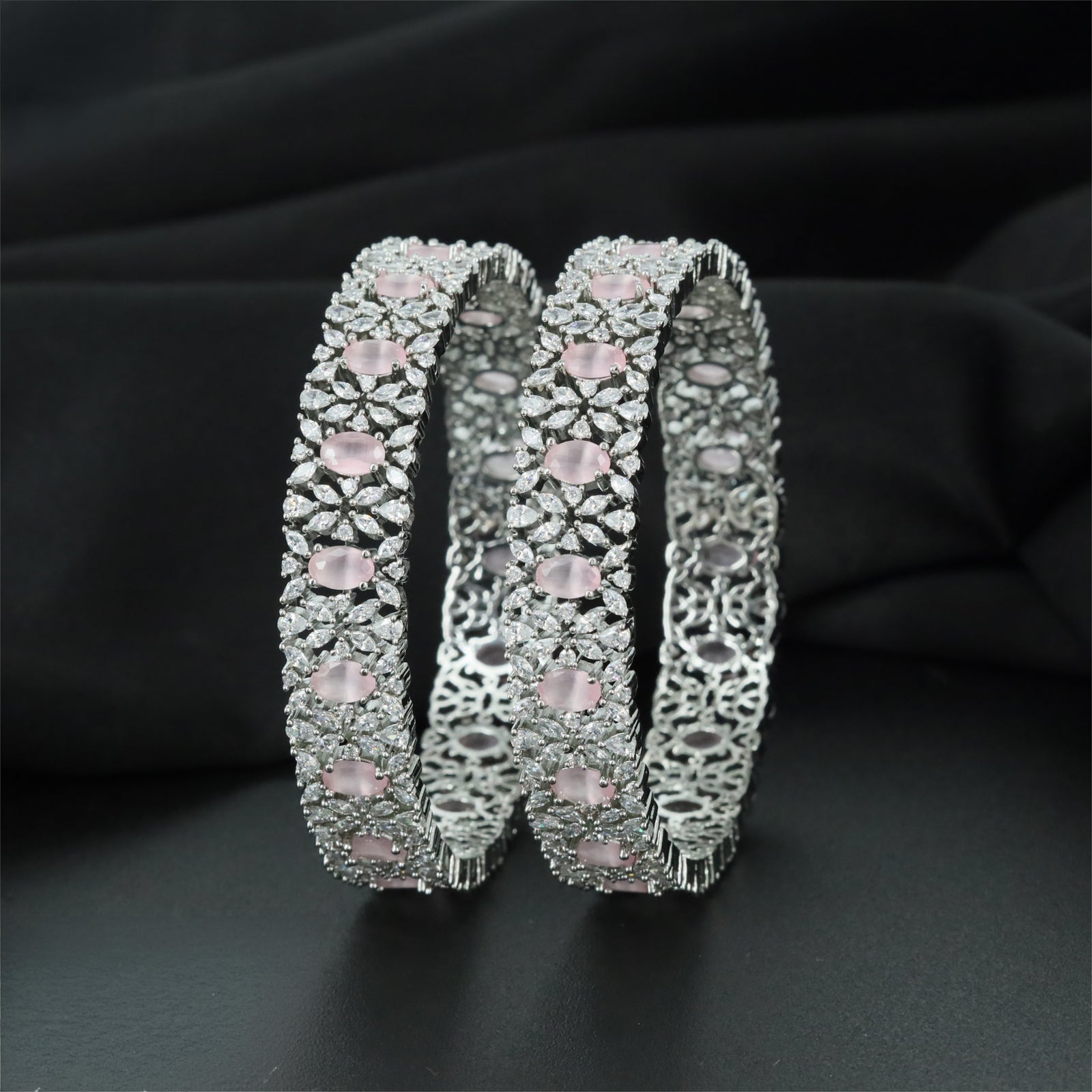Refined Rhodium Bangles with Alternating Oval and Floral Forms