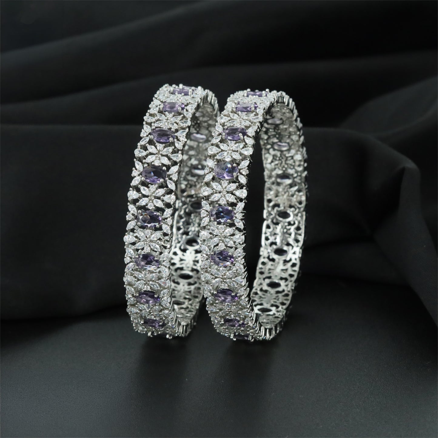 Refined Rhodium Bangles with Alternating Oval and Floral Forms