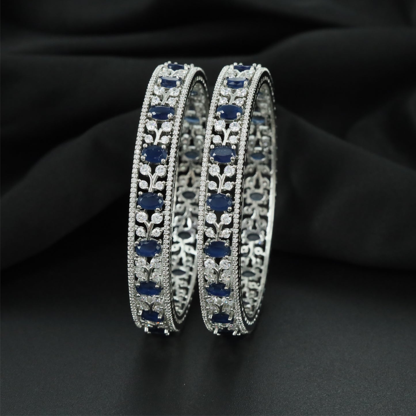 Meadow Curve Rhodium Bangles with Repeating Decorative Formation