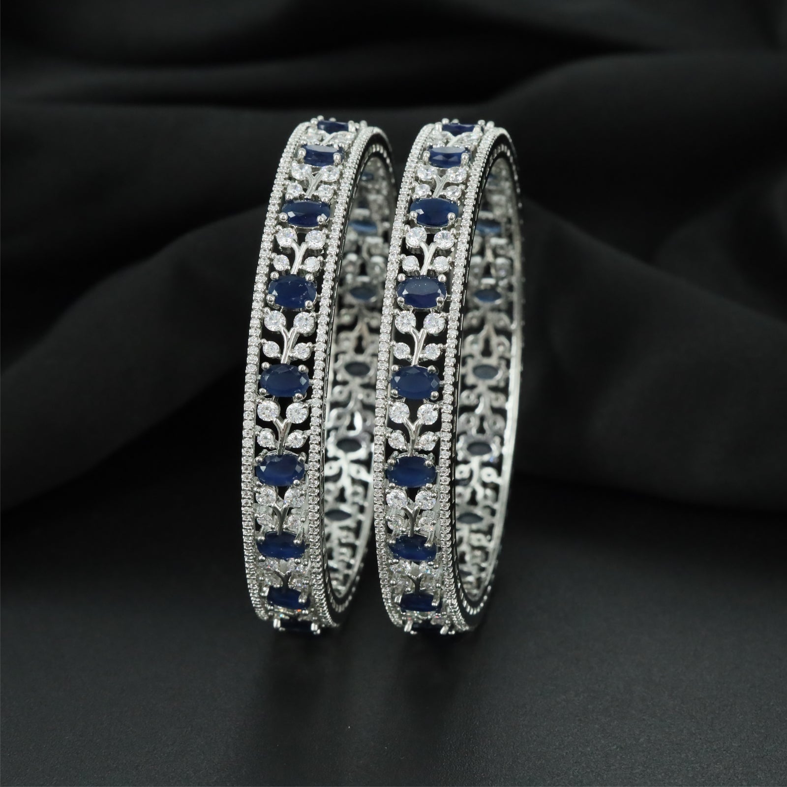 Meadow Curve Rhodium Bangles with Repeating Decorative Formation
