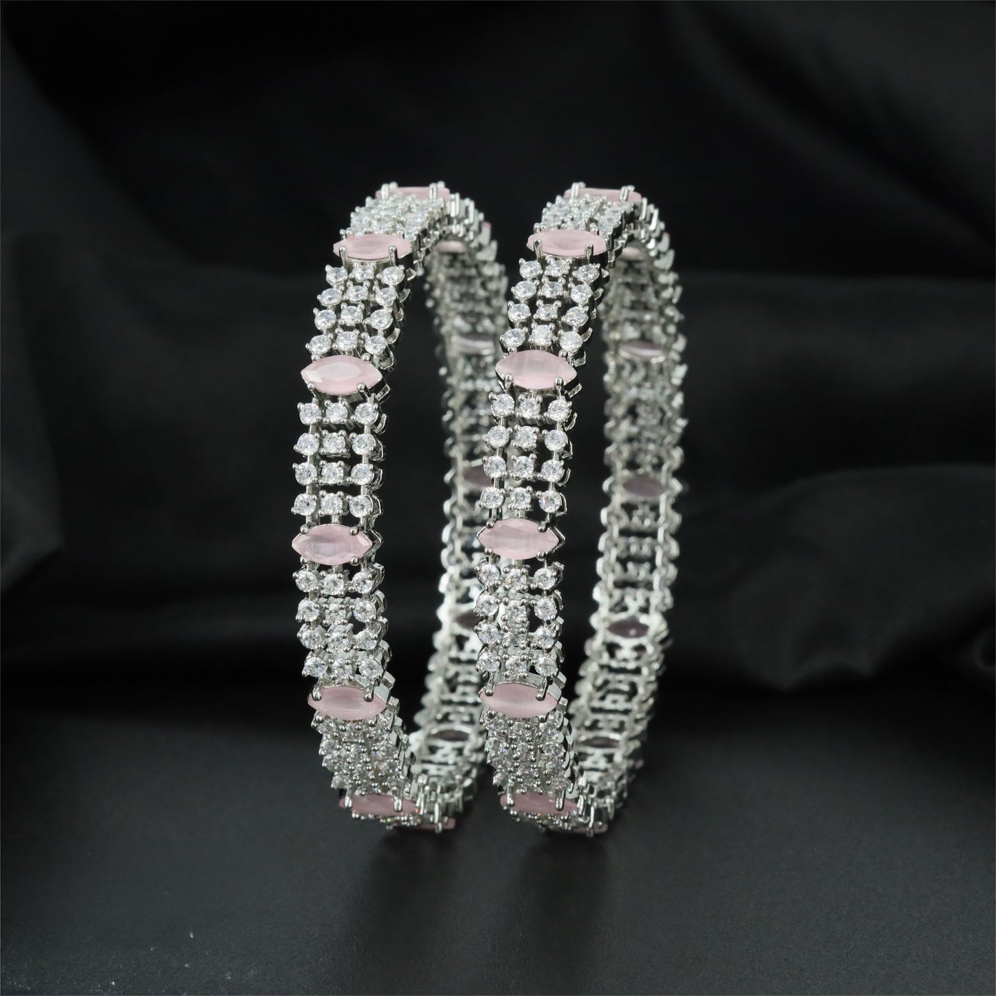 Clustered Rhodium Bangles with Repeating Oval Centre Settings