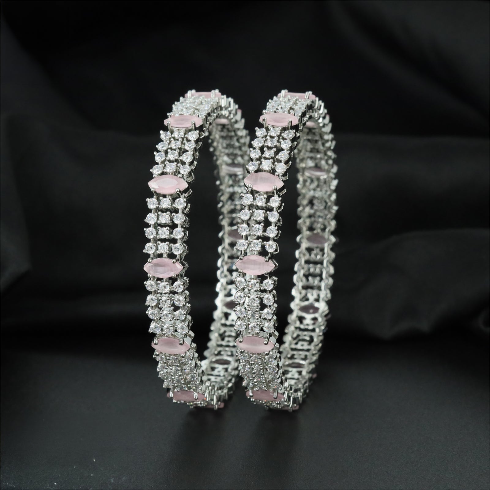 Clustered Rhodium Bangles with Repeating Oval Centre Settings