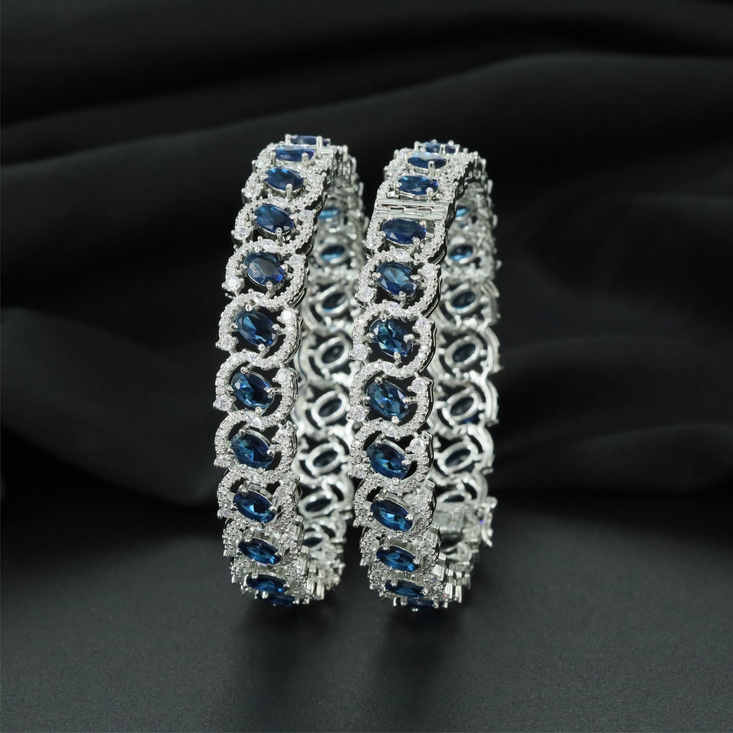 Arc Link Rhodium Bangles with Repeating Oval Frame Sections