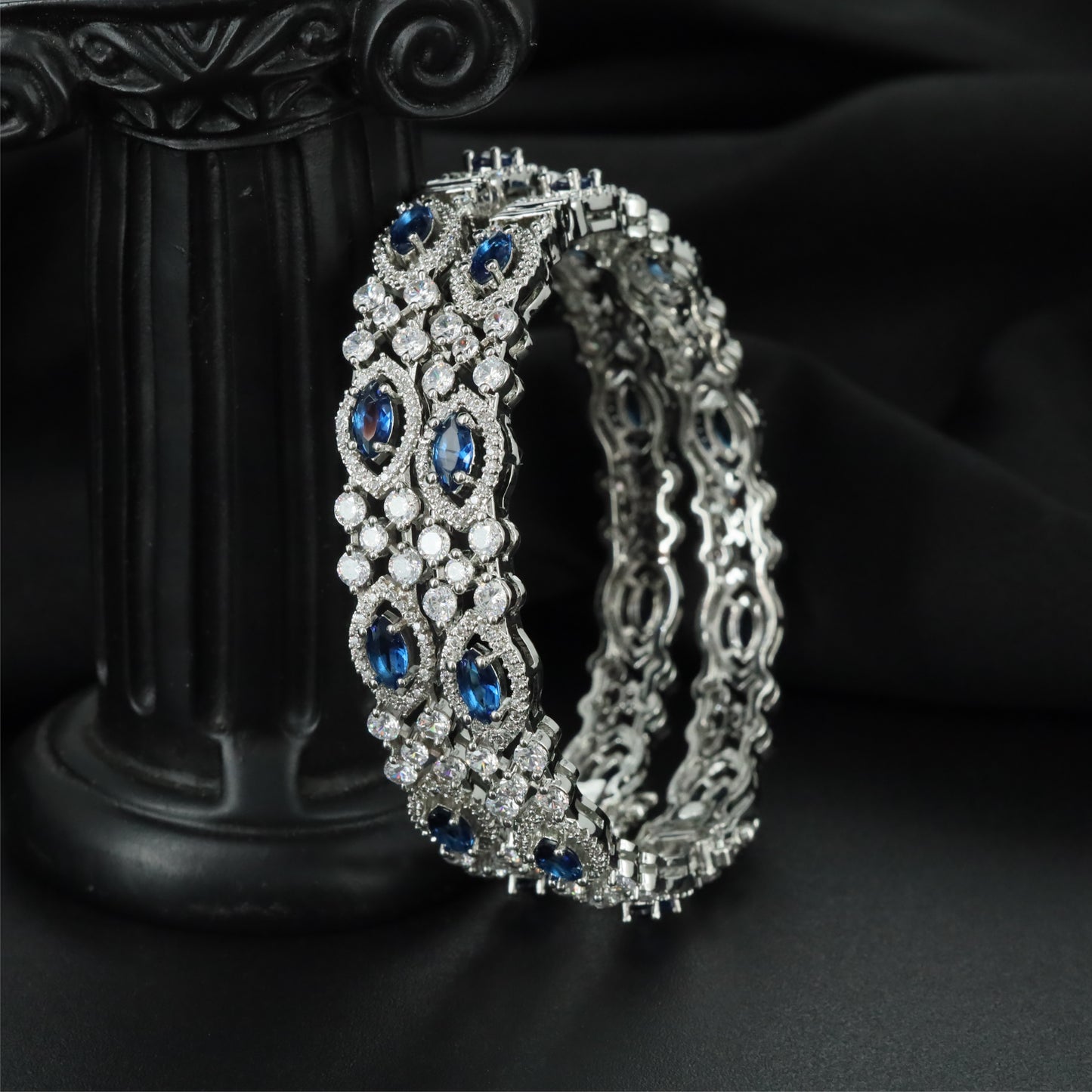 Draped Framework Rhodium Bangles with Intricate Openwork Construction