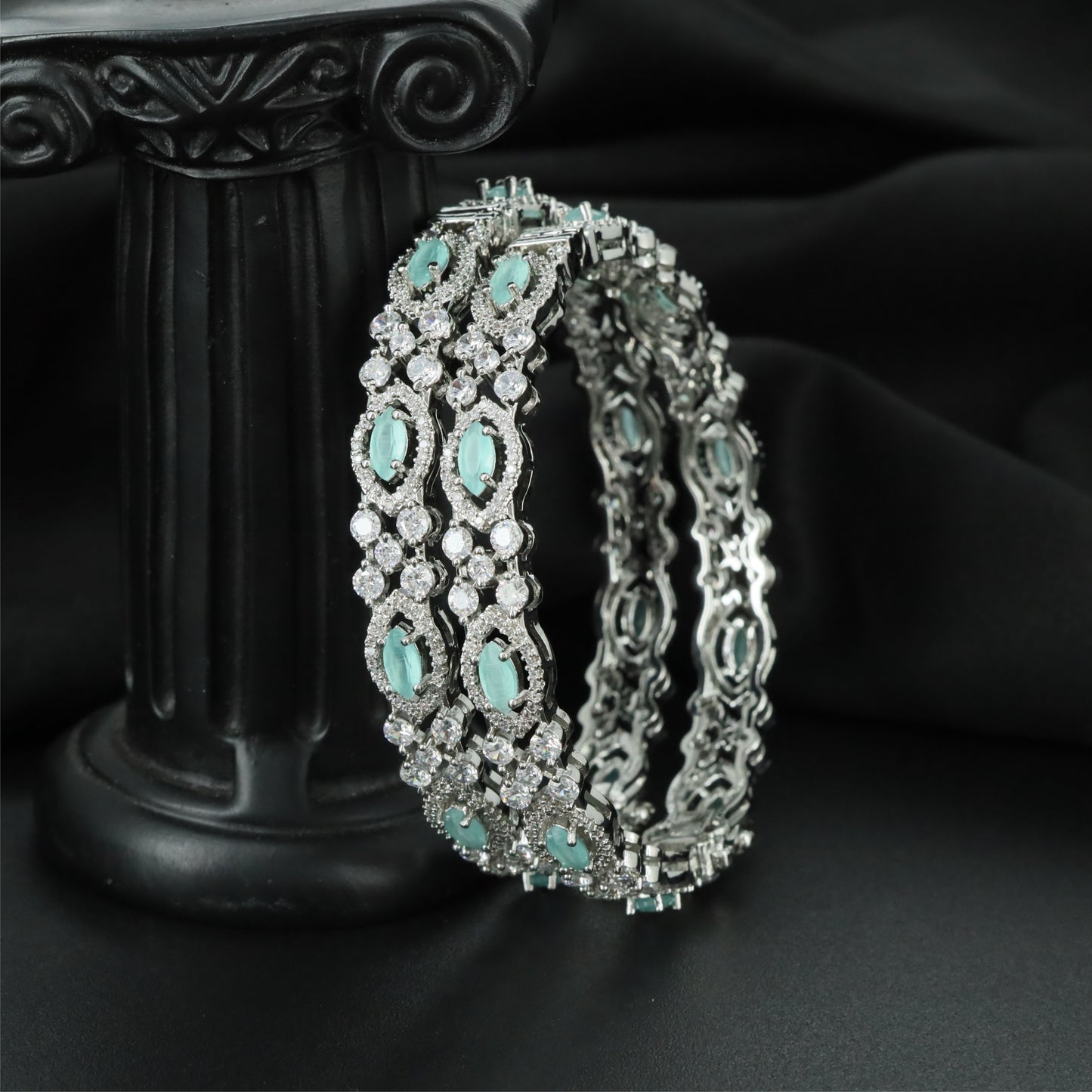Archway Oval Rhodium Bangles with Repeating Marquise Frame Sections