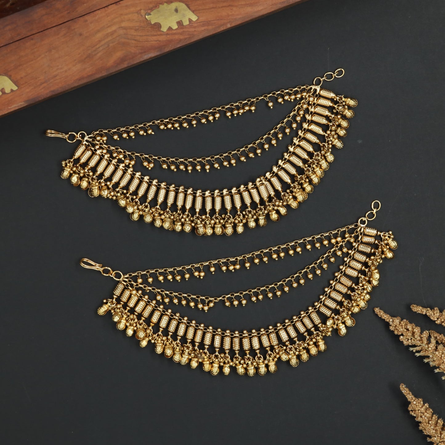 Temple Style Mati with Vertical Border Elements and Cascading Drops