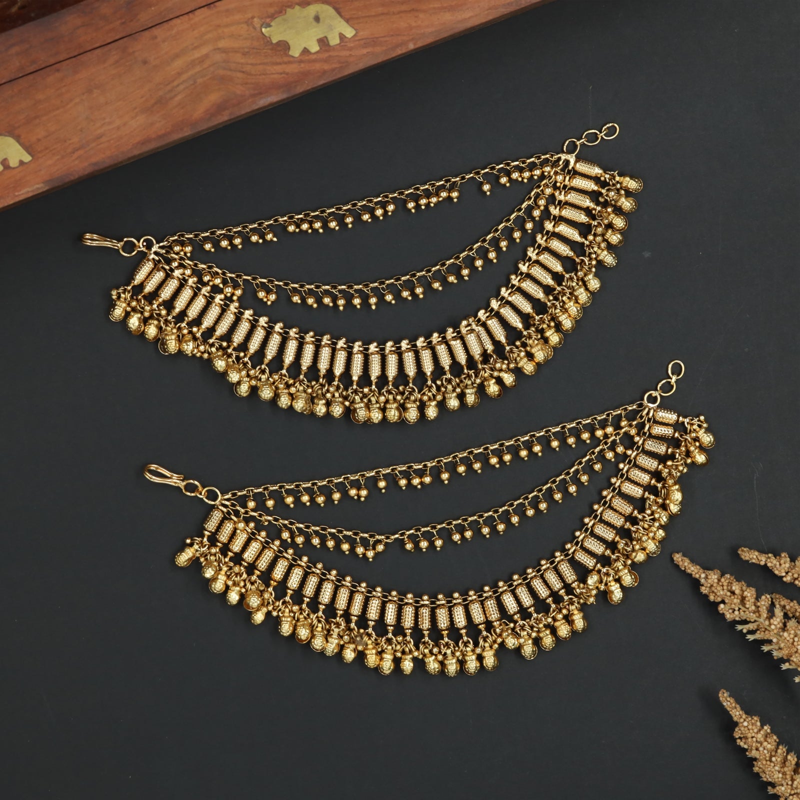 Temple Style Mati with Vertical Border Elements and Cascading Drops