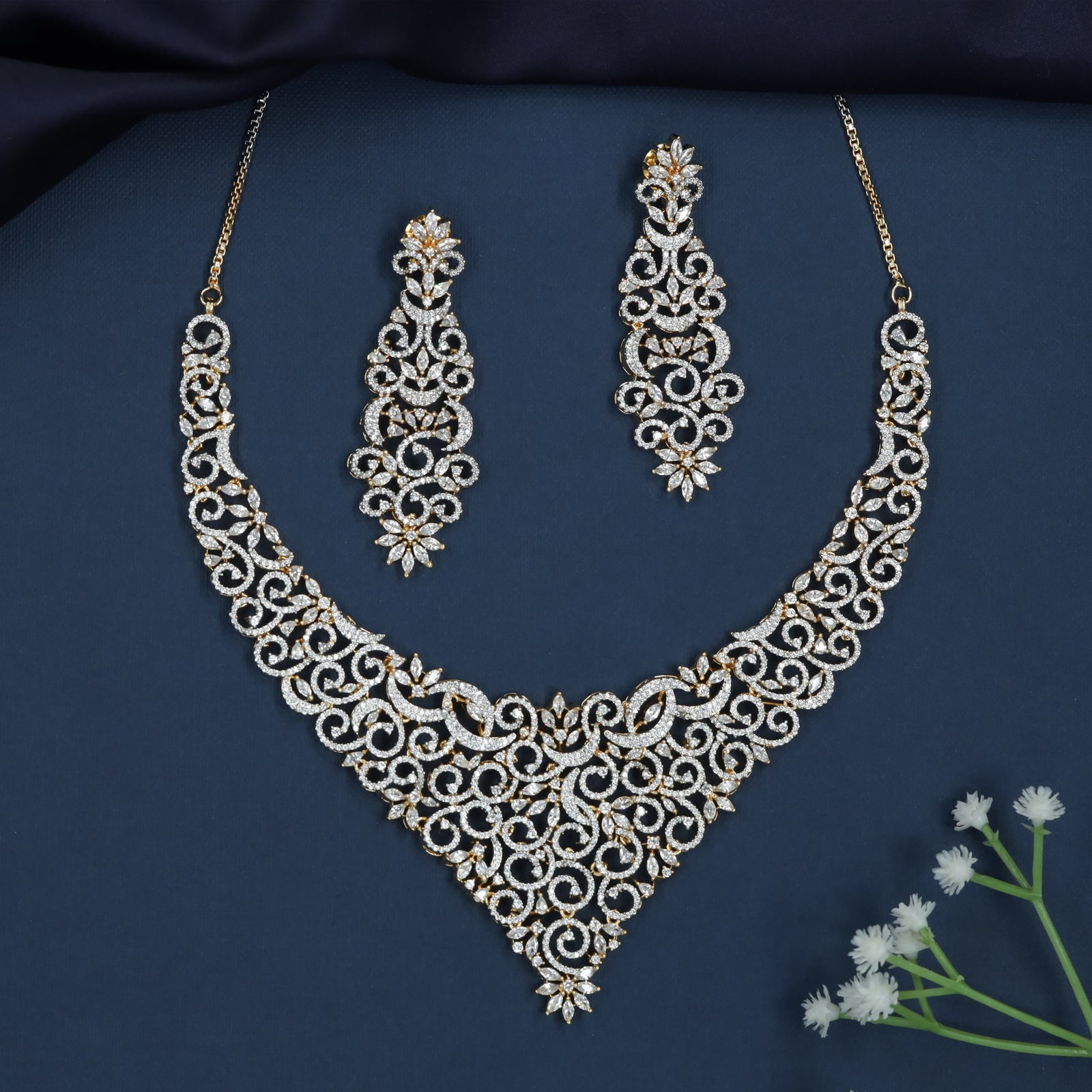 Braided Swirl Necklace with Decorative Floral Accents
