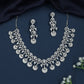 Dangling Disc Rhodium Necklace with Teardrop Border Styling