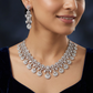 Dangling Disc Rhodium Necklace with Teardrop Border Styling