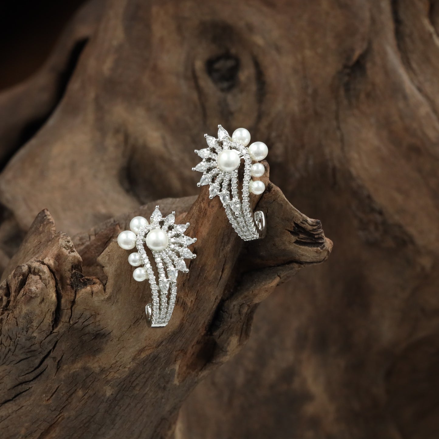 Dazzling swirl rhodium stud with marquise floral pattern