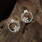 Jeweled round Stud with open floral arrangement