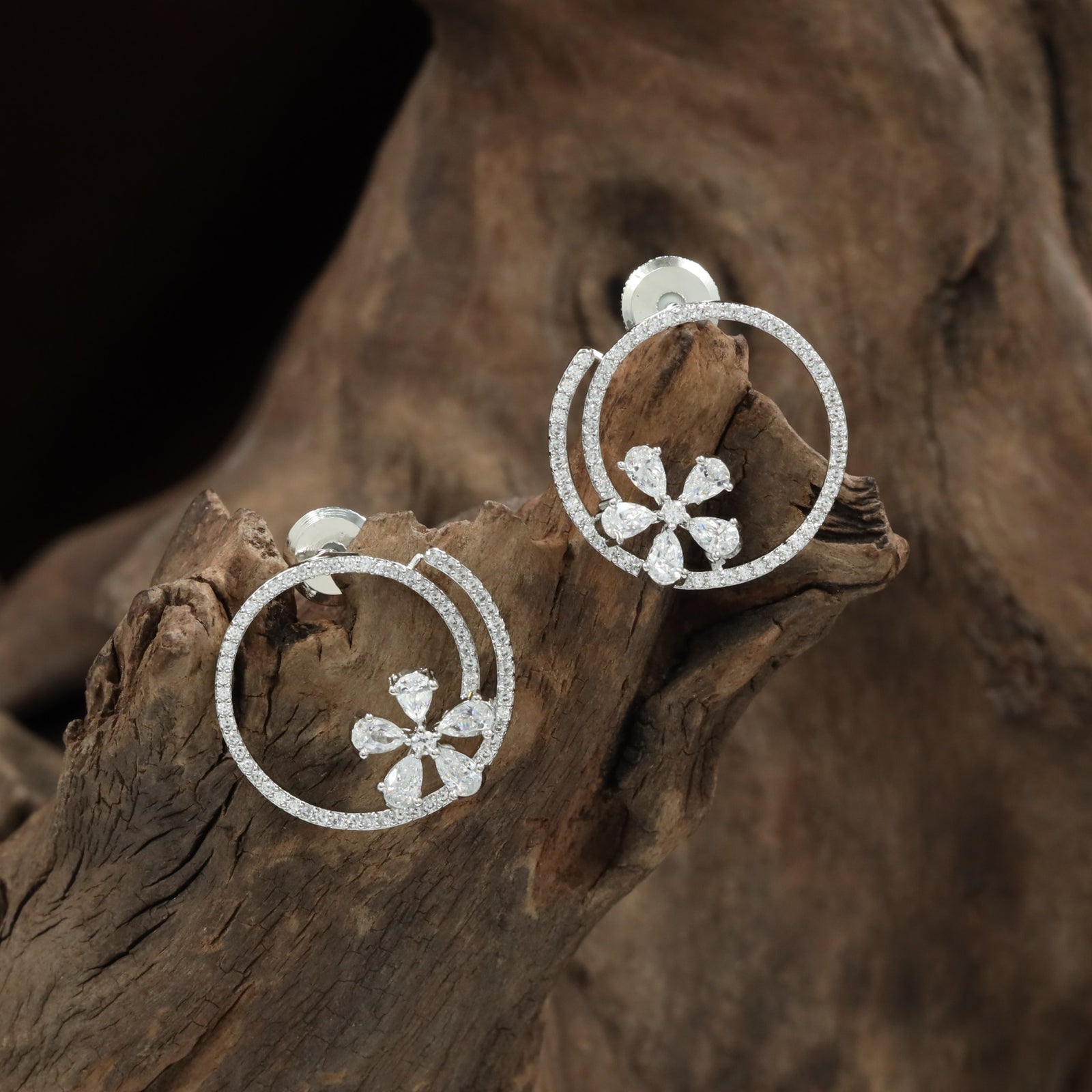 Jeweled round Stud with open floral arrangement