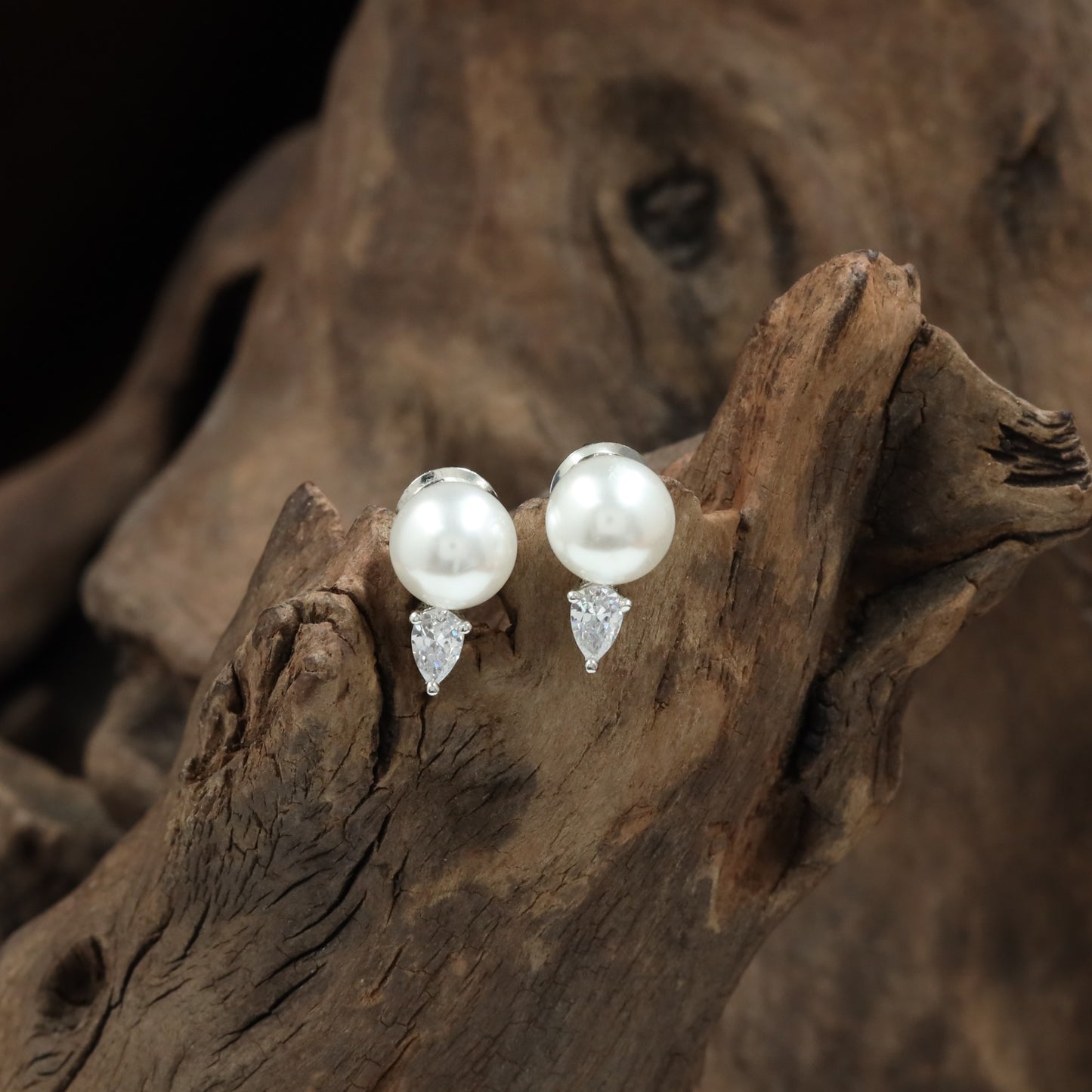 Flared pearl rhodium Stud with hanging teardrop styling
