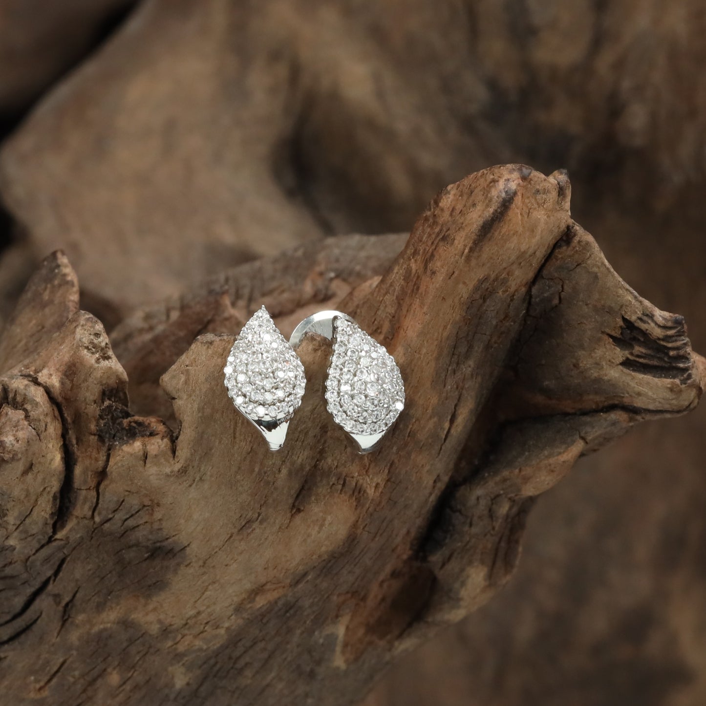 Flared pear rhodium Stud with dense stone arrangement