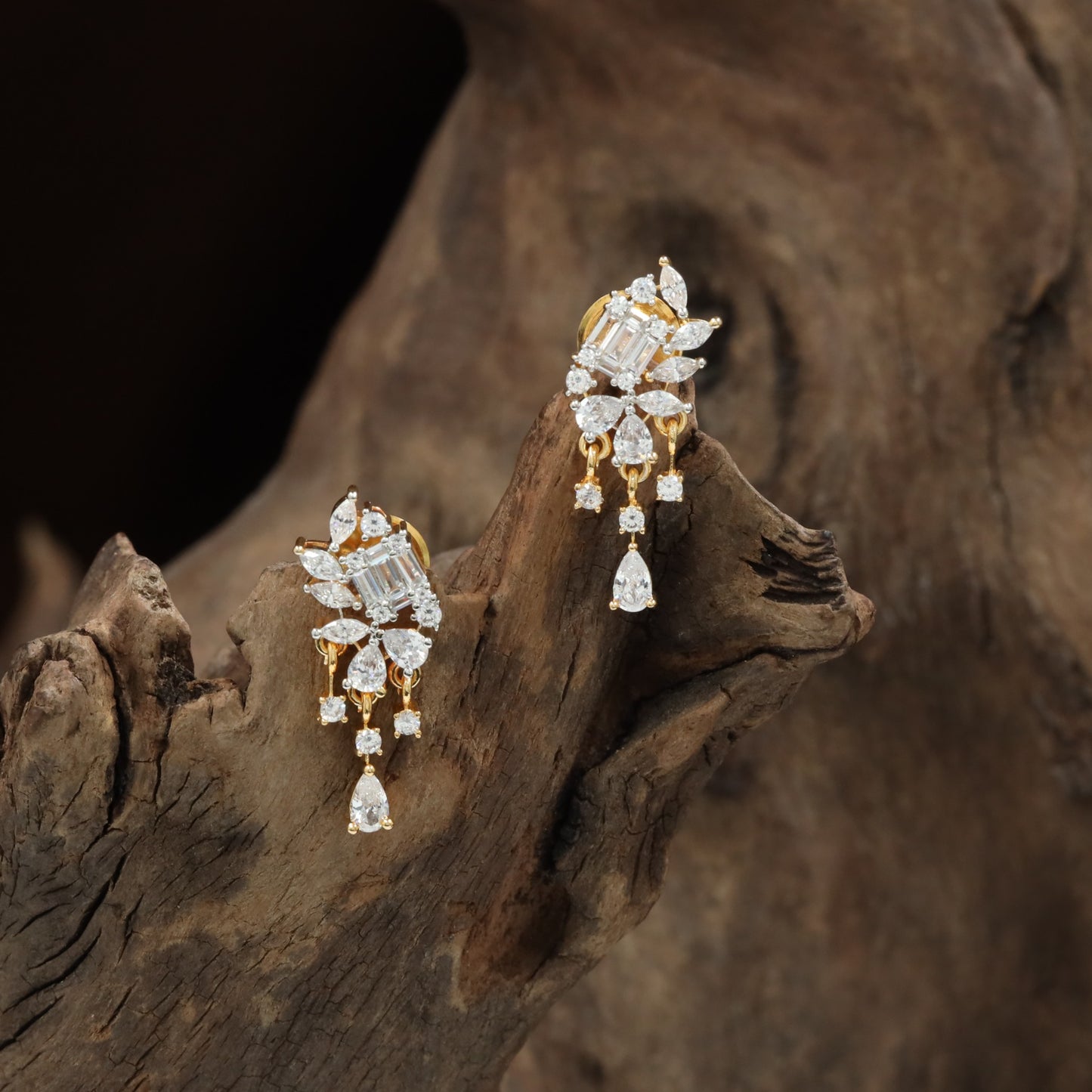 Netted floral Gj Stud with hanging stone arrangement
