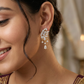 Netted floral Gj Stud with hanging stone arrangement