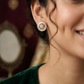 Glittering circle Gj Stud with floral centerpiece styling