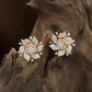 Dewline Spiral Flower Stud with Pointed Edge Accents